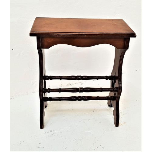 420 - EDWARDIAN MAHOGANY ORGAN STOOL
with an oblong sloping seat on shaped and carved supports united by t... 