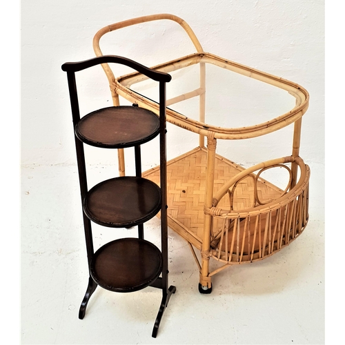 427 - BAMBOO CONSERVATORY TROLLEY
with a shaped glass inset top above a bamboo lower tier with a shaped bo... 