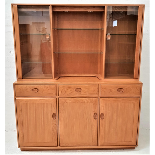 431 - ERCOL LIGHT OAK ILLUMINATED SIDE CABINET
with a moulded top above a central recess with adjustable g... 