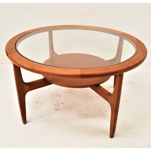 435 - STONEHILL TEAK OCCASIONAL TABLE
with a circular glass inset top standing on four shaped supports uni... 