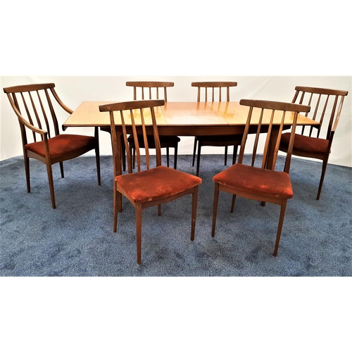 437 - TEAK EXTENDING DINING TABLE AND SIX CHAIRS
the table with a rectangular pull apart top revealing a f... 