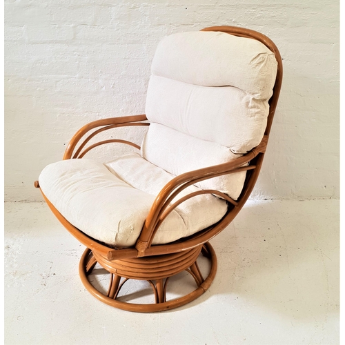 444 - BAMBOO ARMCHAIR
with a loose back and seat cushion, on a circular revolving base