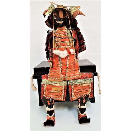 241 - JAPANESE MINIATURE SET OF SAMURAI ARMOUR
with all pieces, on a stand and contained in a lacquer box,... 