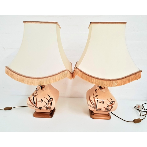 269 - PAIR OF SHAPED POTTERY TABLE LAMPS
raised on square bases, with crackle effect glaze and decorated w... 