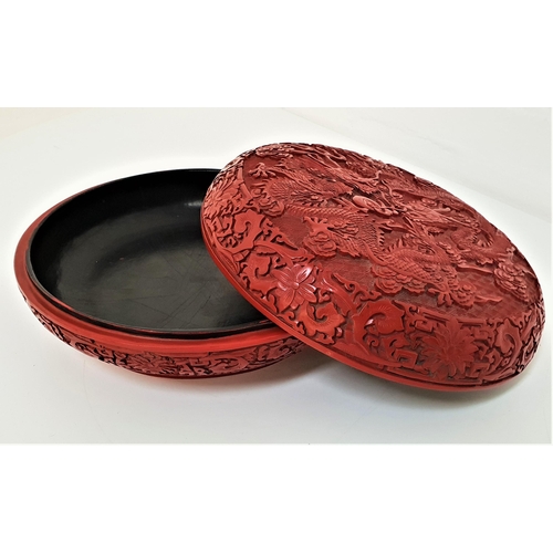 273 - EARLY 20TH CENTURY CHINESE CINNABAR BOWL
and cover, profusely decorated with two five clawed   drago... 