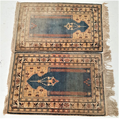 369 - PAIR OF TURKISH PRAYER RUGS
centered with a blue ground with a pair of columns and a decorative susp... 