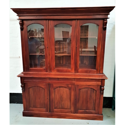 421 - TEAK ILLUMINATED SIDE CABINET
with a moulded cornice above three arched glass panel doors opening to... 