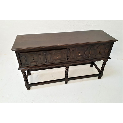 456 - 18th CENTURY STYLE OAK DRESSER BASE
with a rectangular moulded top above two carved panel drawers, s... 