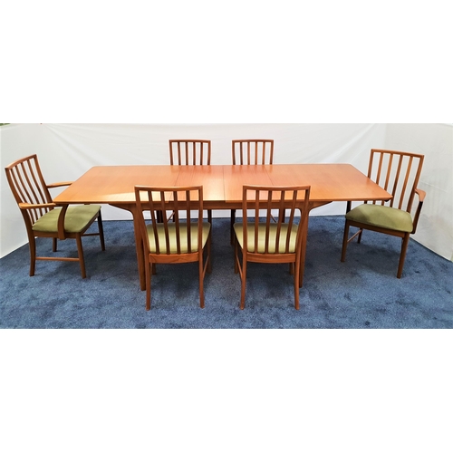 465 - MCINTOSH TEAK EXTENDING DINING TABLE AND SIX CHAIRS
the table with a pull apart top revealing two fo... 