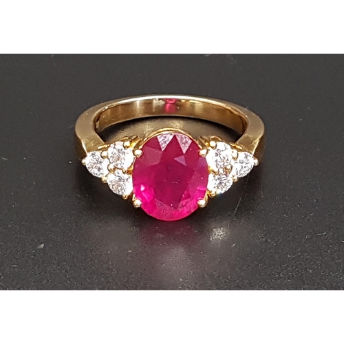 62 - IMPRESSIVE RUBY AND DIAMOND RING
the large central oval cut treated ruby approximately 4.5cts flanke... 