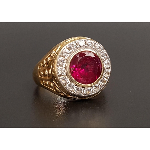 69 - IMPRESSIVE RUBY AND CZ DRESS RING
the central bezel set round cut ruby approximately 2.5cts in sixte... 