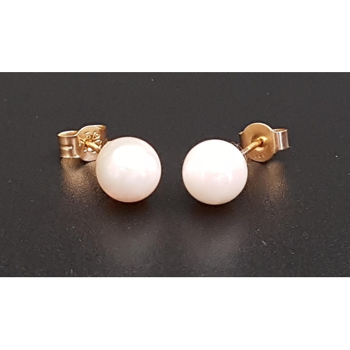 71 - PAIR OF PEARL STUD EARRINGS
the pearls approximately 6.5mm diameter, in nine carat gold