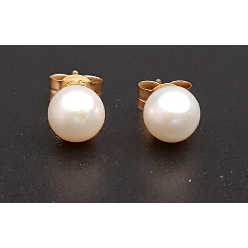 98 - PAIR OF PEARL STUD EARRINGS
the pearls approximately 5.5mm diameter, in nine carat gold