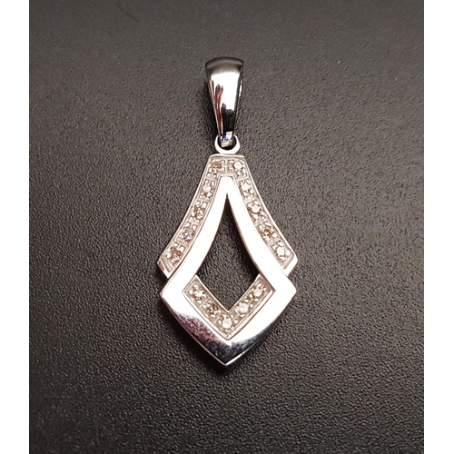 101 - DIAMOND SET PENDANT
of overlapping stylised teardrop form, in nine carat white gold, 3cm high includ... 