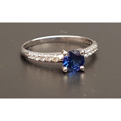 109 - SAPPHIRE AND DIAMOND RING
the central round cut sapphire approximately 0.5cts flanked by diamond set... 