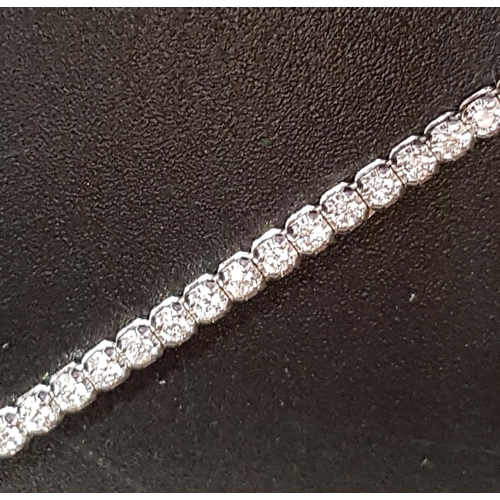 104 - DIAMOND SET EIGHTEEN CARAT WHITE GOLD LINE BRACELET
the diamonds totaling approximately 1.5cts and 1... 