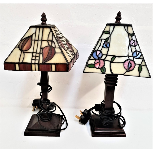 277 - PAIR OF TIFFANY STYLE LAMPS
with square section opaque shades, raised on square stepped bases, 39cm ... 