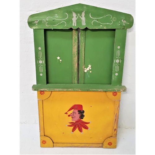 299 - CHILDRENS WOODEN PUNCH AND JUDY THEATRE STAND
with a shaped painted and stenciled front panel with a... 