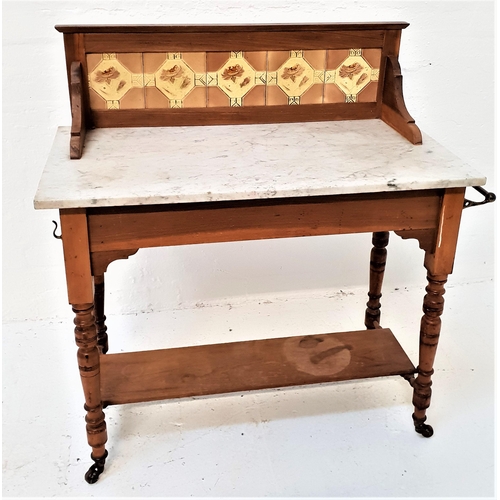 375 - EDWARDIAN WASHSTAND
with a raised tiled back above a grey marble top with side mounted brass hooks a... 