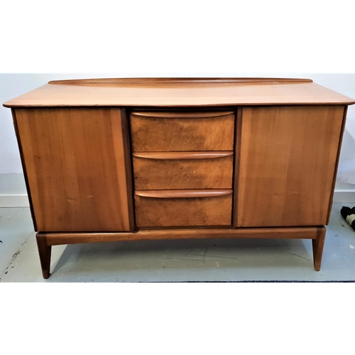 407 - MCINTOSH TEAK SIDEBOARD
with a raised back above a bow front with three central drawers flanked by a... 