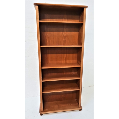 414 - OAK OPEN FRONT SET OF SHELVES
with a moulded top above five adjustable shelves, standing on bun feet... 