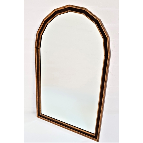 447 - MAHOGANY AND GILT WALL MIRROR
with an arched frame and an arched bevelled plate, 65cm high