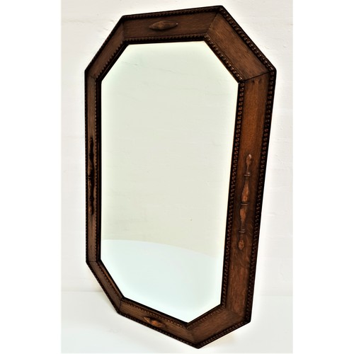 362 - OAK OCTAGONAL WALL MIRROR
with a bevelled plate, 78.5cm high