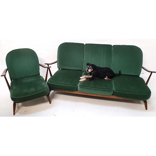 412 - ERCOL THREE SEAT SOFA
in stained beech with a stick back and shaped arms with loose seat and back cu... 