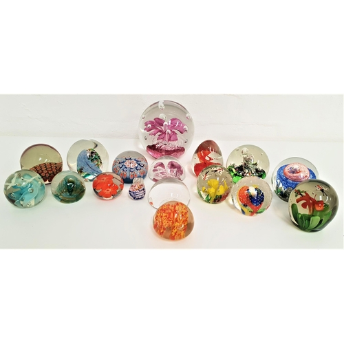 232 - SEVENTEEN GLASS PAPERWEIGHTS
of varying sizes with examples including a Caithness Myriad, Caithness ... 