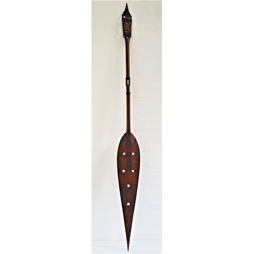 288 - SOUTH PACIFIC CEREMONIAL PADDLE
with a decorative carved and pierced handle and shaped carved and pi... 