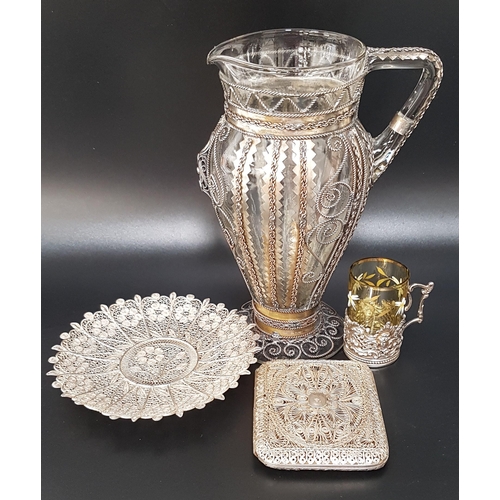 186 - EDWARD VII MINIATURE SILVER BEAKER SLEEVE
with embossed and pierced decoration and a scroll handle, ... 