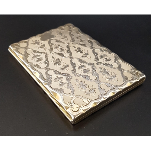 192 - VICTORIAN SILVER CARD CASE
with engine turned decoration, the interior lined in red watered silk wit... 