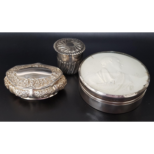 205 - VICTORIAN CIRCULAR SILVER BOX
with embossed decoration to the lid and body, Birmingham 1891; a Victo... 