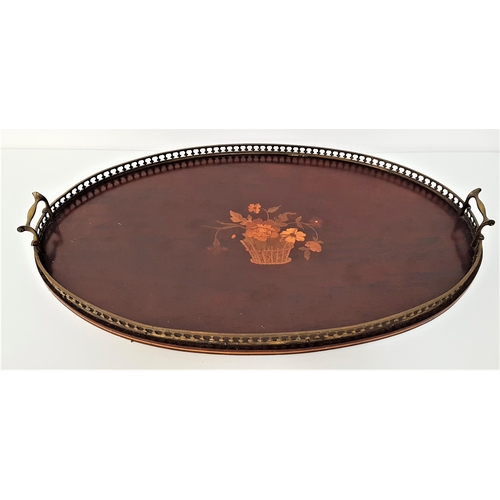 279 - EDWARDIAN MAHOGANY AND INLAID OVAL TRAY
with a raised pierced brass gallery and handles, 68.5cm wide