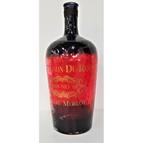 219 - LARGE VINTAGE FRENCH WINE BOTTLE
overpainted in red, the neck wrapped in wire, the body marked in gi... 