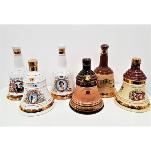 504 - SIX BELLS WADE DECANTERS 
Comprising one to comerorate the 60th birthday of Her Majesty Queen Elizab... 