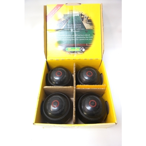 333 - SET OF FOUR THOMAS TAYLOR LAWN BOWLS
size 5 and marked 'A. McD', boxed