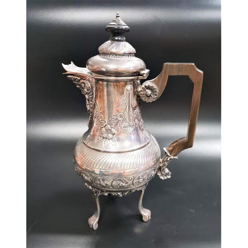 210 - VICTORIAN SILVER HOT WATER JUG
with a circular hinged lid above a flared spout with a mask of Bacchu... 