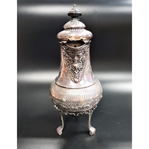 210 - VICTORIAN SILVER HOT WATER JUG
with a circular hinged lid above a flared spout with a mask of Bacchu... 