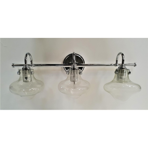 269 - MODERN CHROME WALL LIGHT
the three shaped arms with bulbous clear glass shades, 74.5cm long