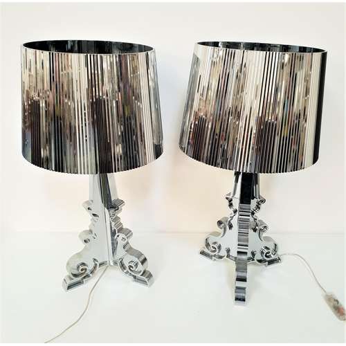 297 - PAIR OF KARTELL TABLE LAMPS
raised on shaped mirrored triform bases with circular ribbed shades, 69c... 