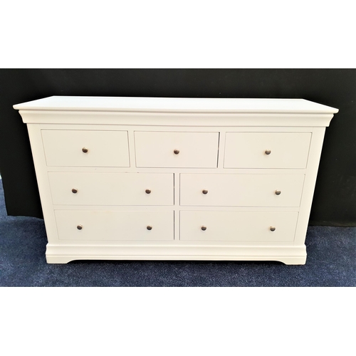 435 - LARGE WHITE BEDROOM CHEST
with a moulded top above three frieze drawers with two pairs of long drawe... 