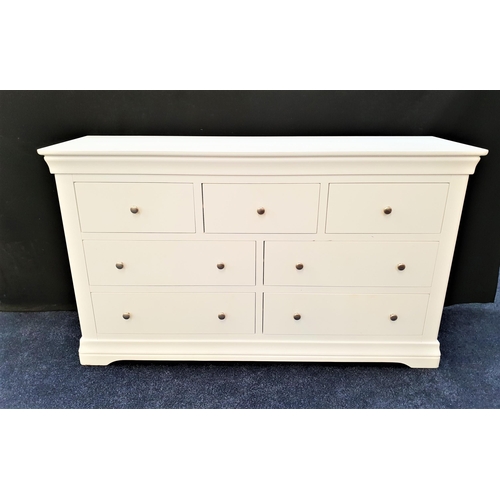 436 - LARGE WHITE BEDROOM CHEST
with a moulded top above three frieze drawers with two pairs of long drawe... 