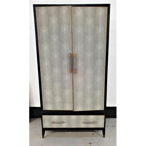 437 - MODERN DESIGNER WARDROBE
in black ash with faux lizard skin double doors opening to reveal a shelf a... 