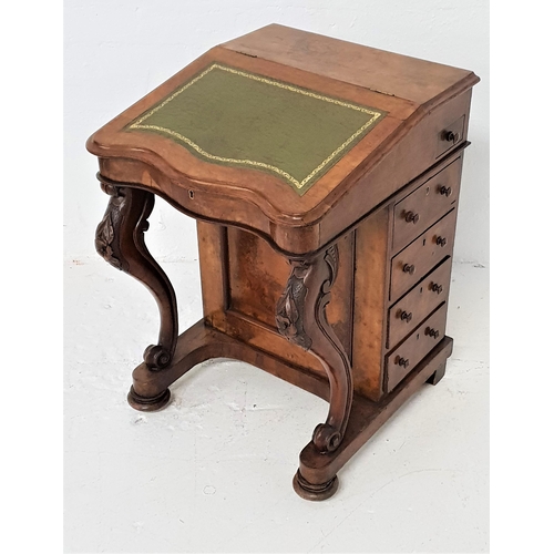 441 - VICTORIAN WALNUT DAVENPORT
with a lift up lid inset with a green leather, the interior with two draw... 