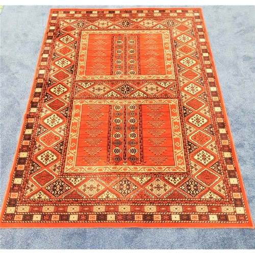 446 - ARAK SUPREME RUG
with a rust ground with stylised panels, 290cm x 200cm