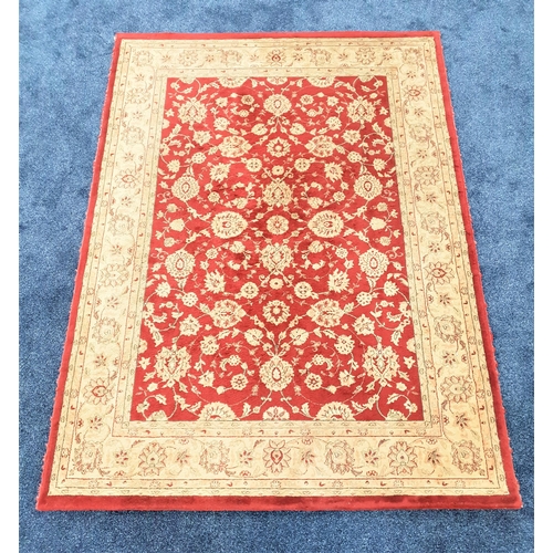 449 - CLARET GROUND RUG
with floral motifs, 228cm x 170cm