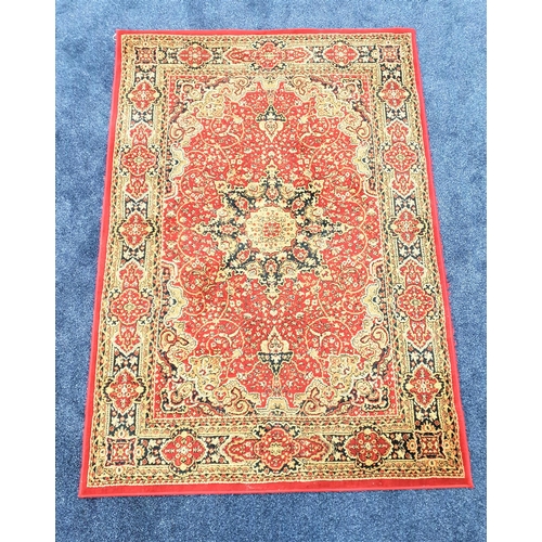 452 - VALBY RUG
with a claret ground and elaborate design, 95cm x 133cm