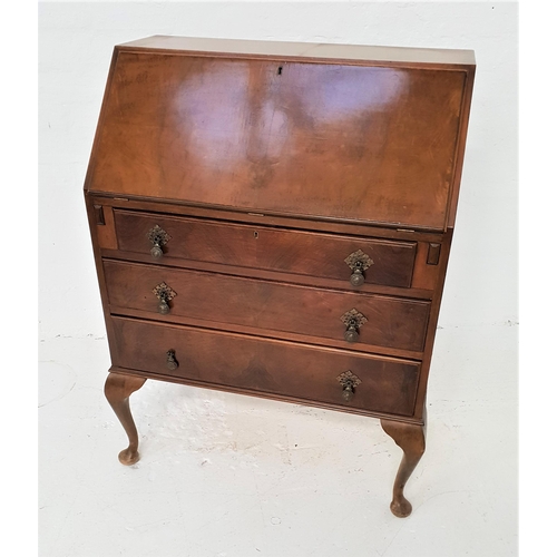 470 - WALNUT BUREAU
with a fall flap opening to reveal a fitted interior above three long panelled drawers... 