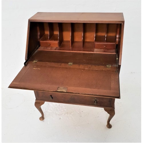 470 - WALNUT BUREAU
with a fall flap opening to reveal a fitted interior above three long panelled drawers... 